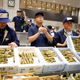Auctioneers take part in a wasabi auction.